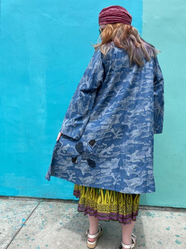 product details: CUSTOM BLUE DENIM CAMO EMBROIDERED HIGH/LOW OVERSIZED MUMU BLOUSE W/ ARCHITECTURAL POCKETS photo