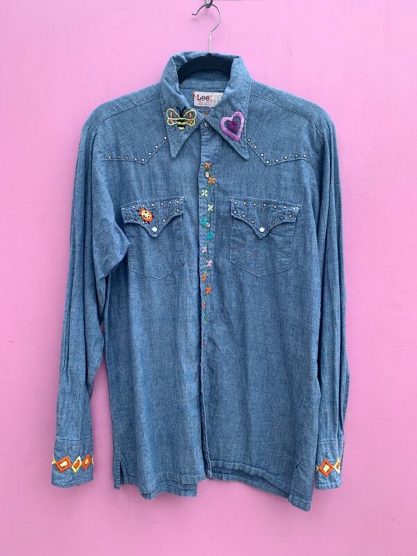 product details: 1970S DENIM LONG SLEEVE W/ FLARED DAGGER COLLAR AND HAND STITCHED FLOWERS, BUGS, AND OCEAN SUNSET photo