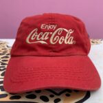 EMBROIDERED ENJOY COCA COLA LOGO DAD HAT W/ RIVETS ON SIDE STRAP BACK CLOSURE AS-IS