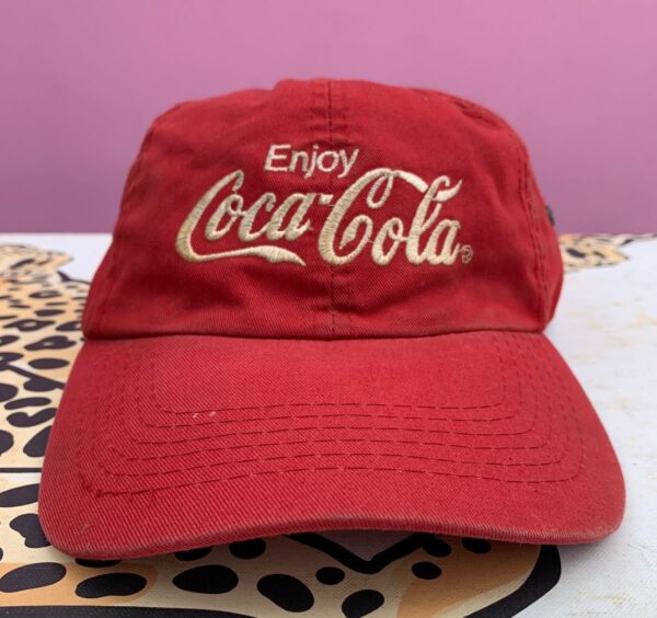 product details: EMBROIDERED ENJOY COCA COLA LOGO DAD HAT W/ RIVETS ON SIDE STRAP BACK CLOSURE AS-IS photo