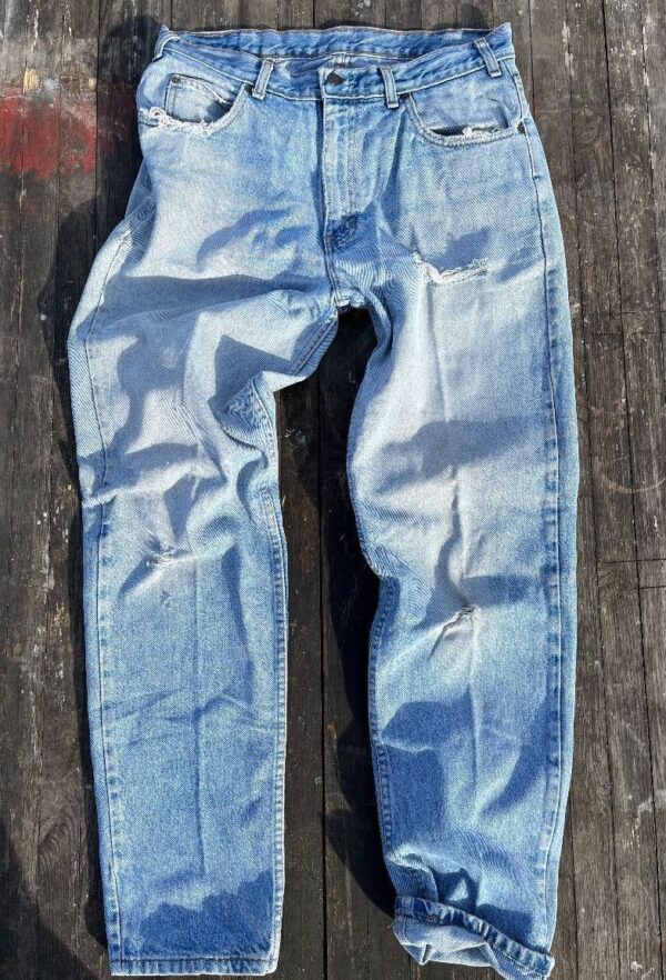 product details: 1990S PERFECTLY DISTRESSED SLIGHT TAPER LIGHT WASH DENIM JEANS photo