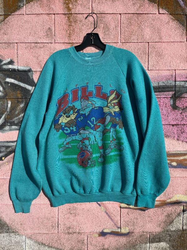 product details: AS-IS TEAL OVERDYED BUFFALO BILLS LOONEY TUNES SQUAD GRAPHIC CREWNECK SWEATSHIRT photo
