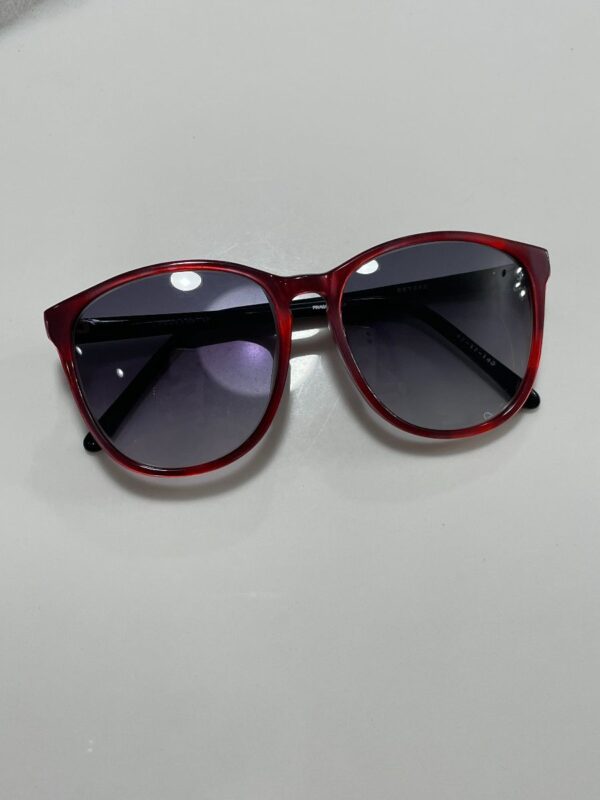 product details: RED PEARLIZED FRAME BLACK ARM SMOKE LENSE SUNGLASSES photo