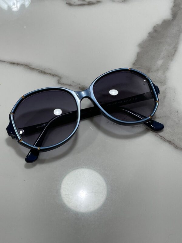 product details: FUNKY CHISELED PEARLIZED BLUE FRAME SUNGLASSES WITH GOLD NOTCH DETAIL photo