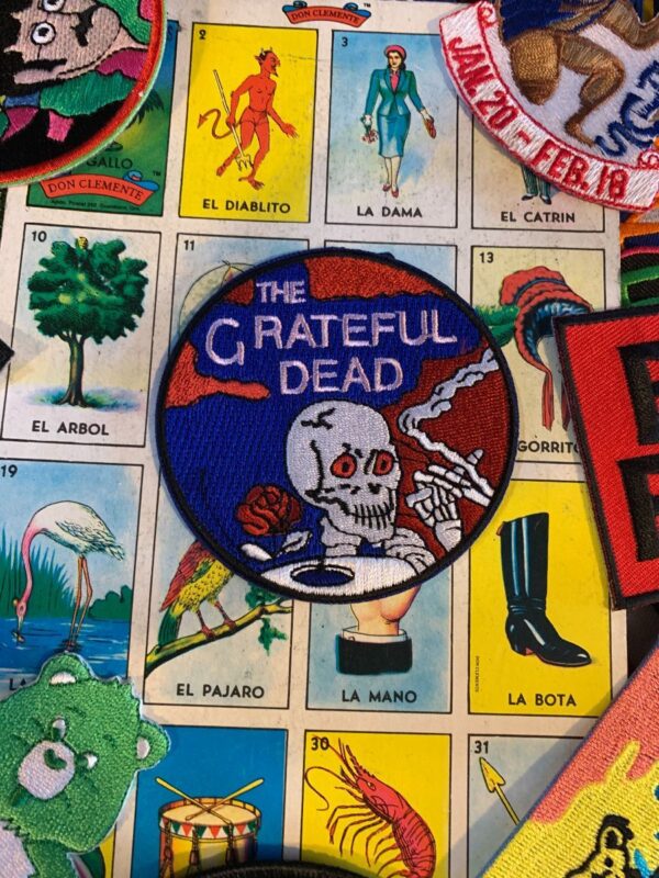 product details: NEW PATCH - THE GRATEFUL DEAD SMOKING SKELETON ROUND EMBROIDERED PATCH photo