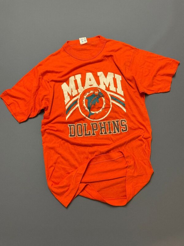 product details: RETRO MIAMI DOLPHINS GRAPHIC SHORT SLEEVE SINGLE STITCHED T-SHIRT photo