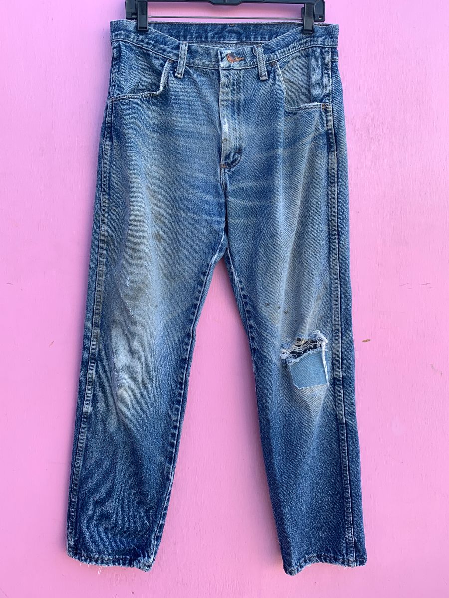 product details: PERFECTLY DISTRESSED DENIM JEANS WITH RIPS & PATCHED KNEE photo