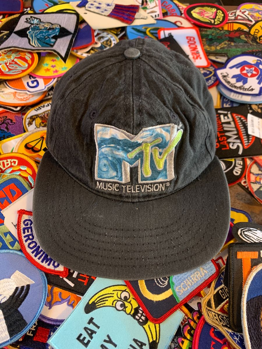 product details: DISTRESSED EMBROIDERED MTV LOGO SNAPBACK HAT photo