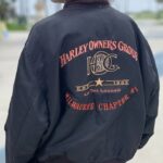 MILWAUKEE CHAPTER #1 HARLEY OWNERS GROUP WITH LEATHER H.O.G PATCH RED INNER LINING MULTIPOCKET  BOMBER JACKET.