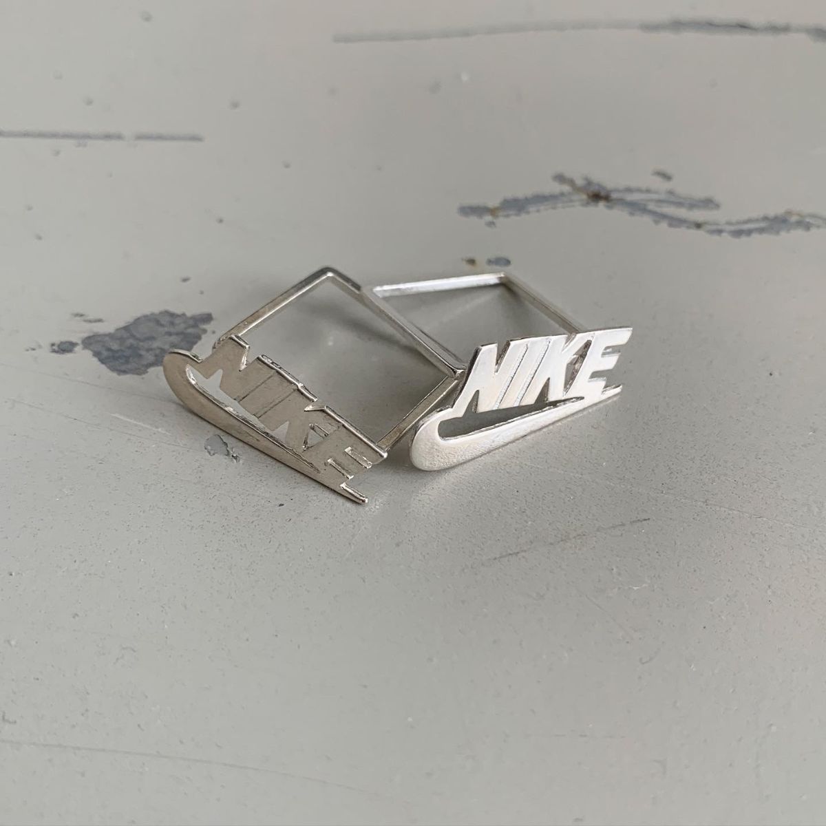 product details: SILVER NIKE RING CLASSIC THIN SQUARE BASE photo