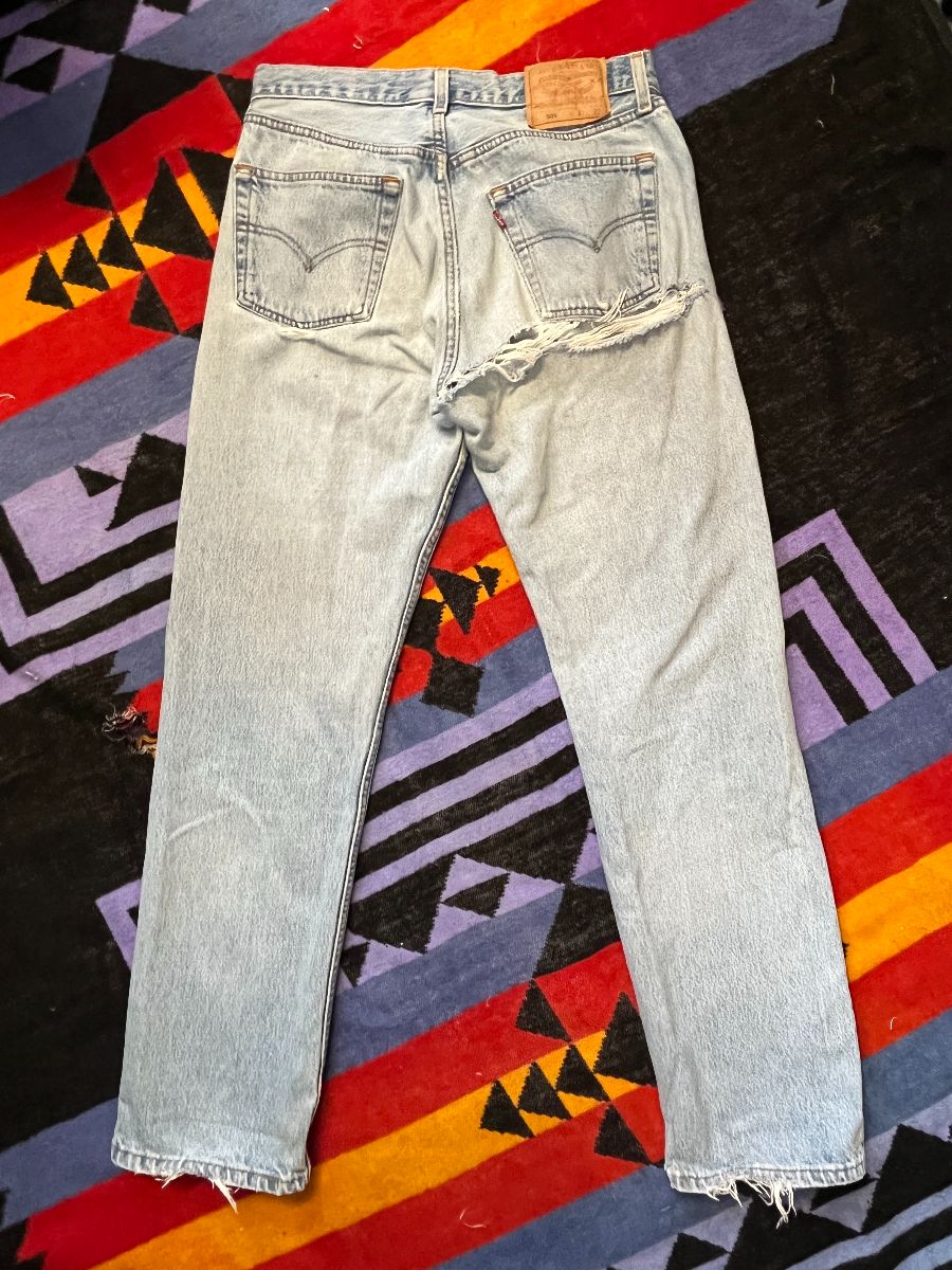 product details: *AS-IS* KILLER! LEVIS 501 HEAVILY DISTRESSED TORN BACK LIGHT WASH DENIM JEANS photo