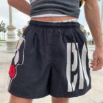 AS-IS 1980S-90S SUN FADED BIG DOGS OVERSIZED LOGO SWIM SHORTS