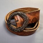 1970S HIPPY FADED & DISTRESSED BROWN LEATHER HEART EMBOSSED BELT LARGE ROUNDED BRUTALIST STYLE BUCKLE
