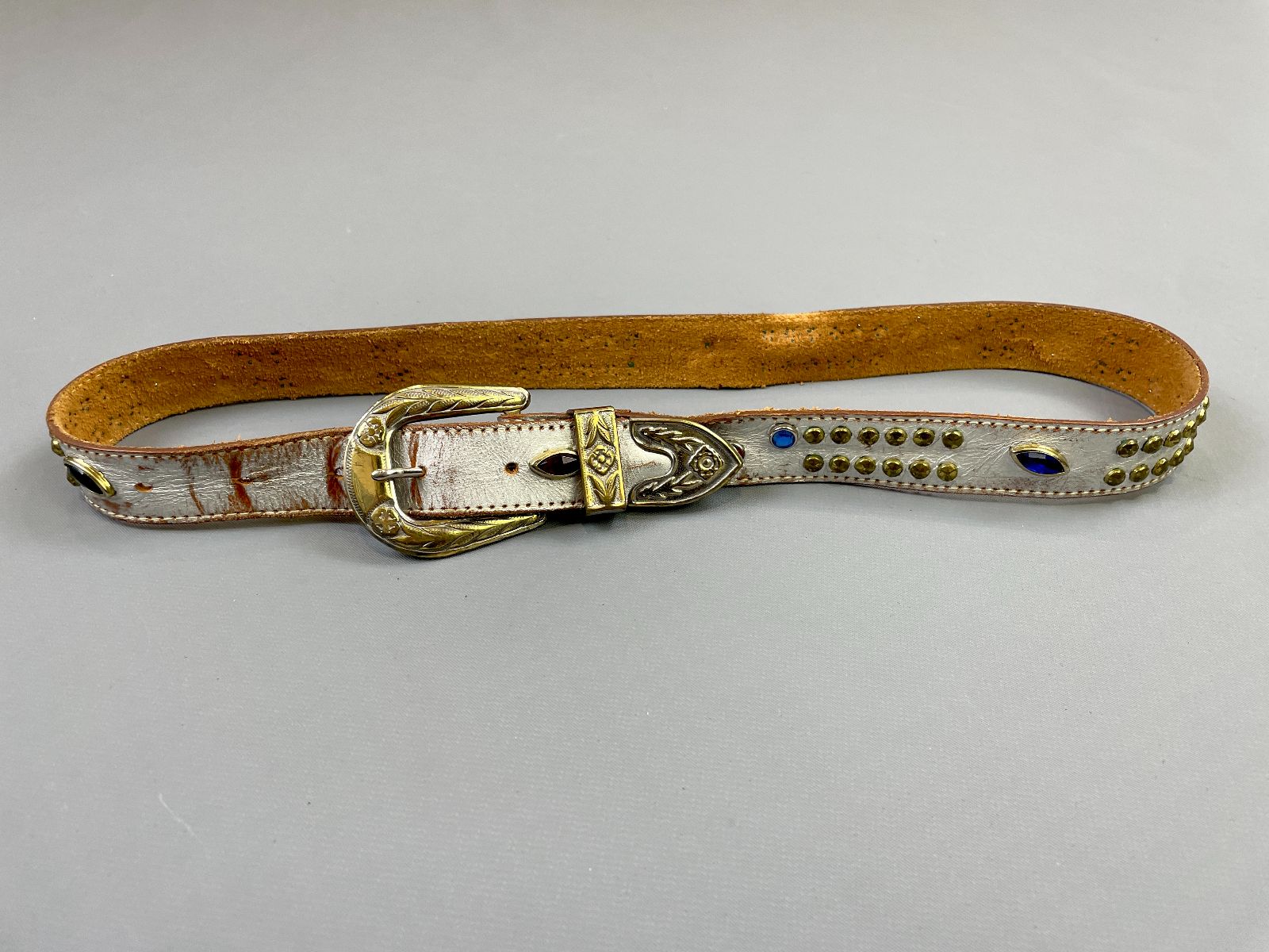 product details: AS-IS LIGHTLY DISTRESSED HAND STUDDED SILVER PAINTED LEATHER BELT photo