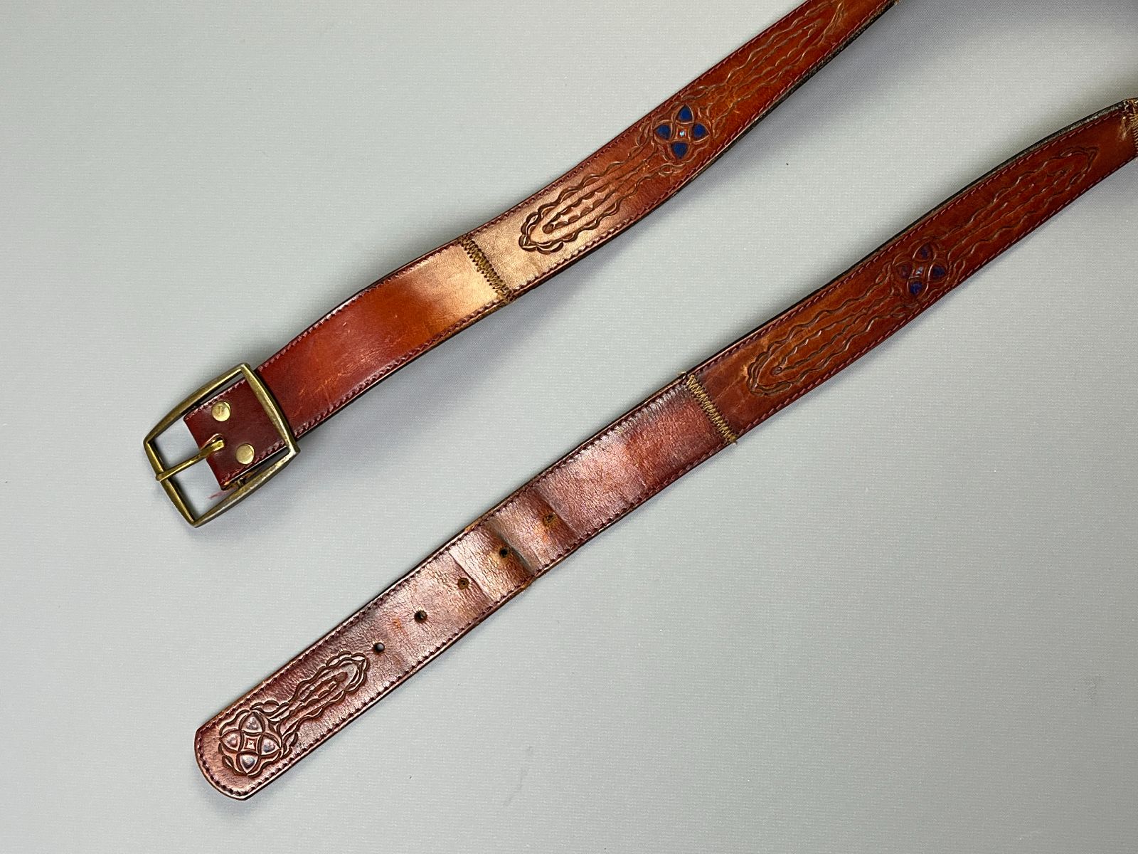 product details: EMBOSSED & HAND-STAINED GEOMETRIC DESIGN LEATHER BELT BRAIDED DETAIL photo