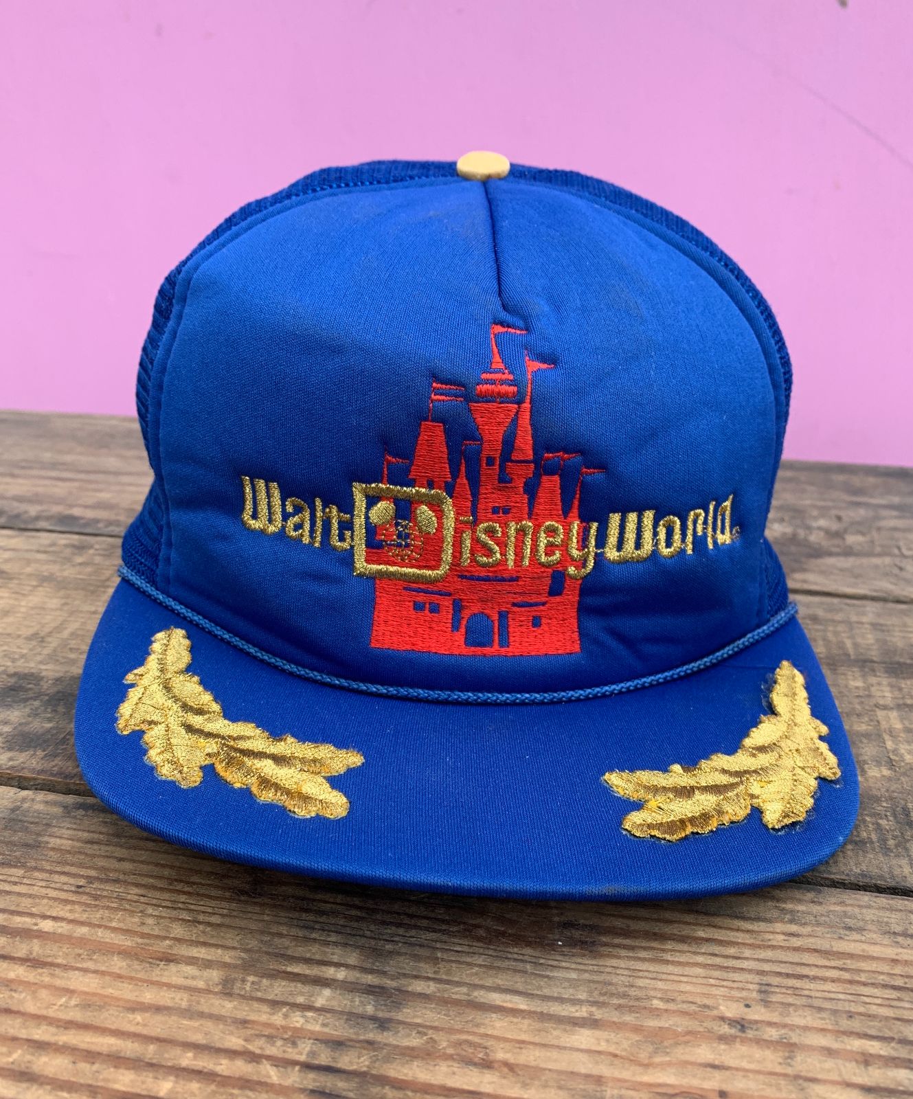 product details: AS-IS RETRO DISNEYLAND EMBROIDERED TRUCKER HAT W/ SCRAMBLED EGG EMBELESHMENT ON BRIM photo