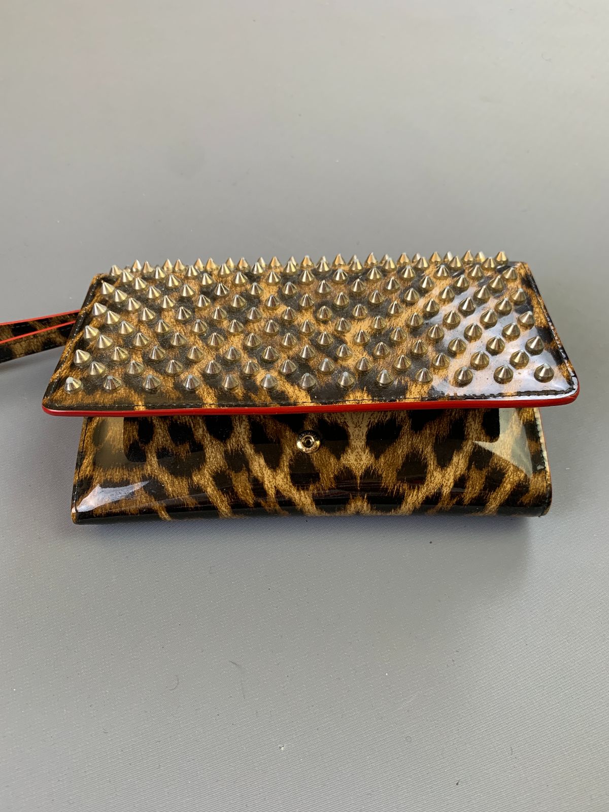 product details: AS-IS SPIKE STUDDED PATENT LEATHER LEOPARD PRINT WALLET photo