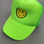 EMBROIDERED DEAD SMILEY FACE DAYGLOW GREEN TRUCKER HAT