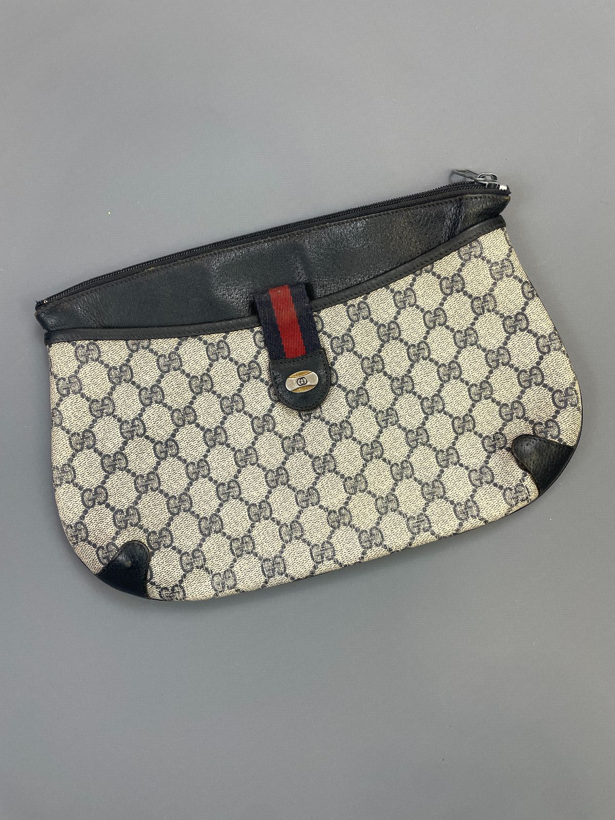product details: *AS-IS* 1980S GUCCI MONOGRAM VINYL & LEATHER CLUTCH ACCESSORY COLLECTION photo