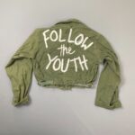 CUSTOMIZED CROPPED & HAND-PAINTED VIETNAM ERA MILITARY JACKET – FOLLOW THE YOUTH BACK MESSAGE
