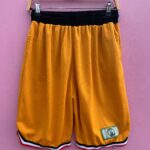 NBA GOLD BASKETBALL SHORTS W/ RED AND BLACK TRIM AND CELTICS PATCH