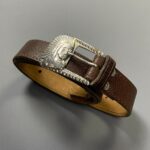NARROW LEATHER BELT W/ STAMPED METAL CHIEF INDIAN DESIGN BUCKLE