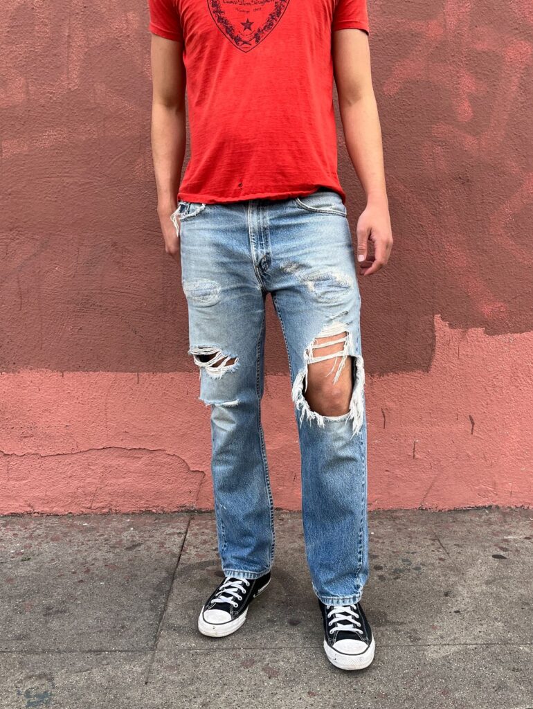 PERFECTLY WORN MENDED LEVIS 505 STRAIGHT LEG FADED BLUE DENIM JEANS