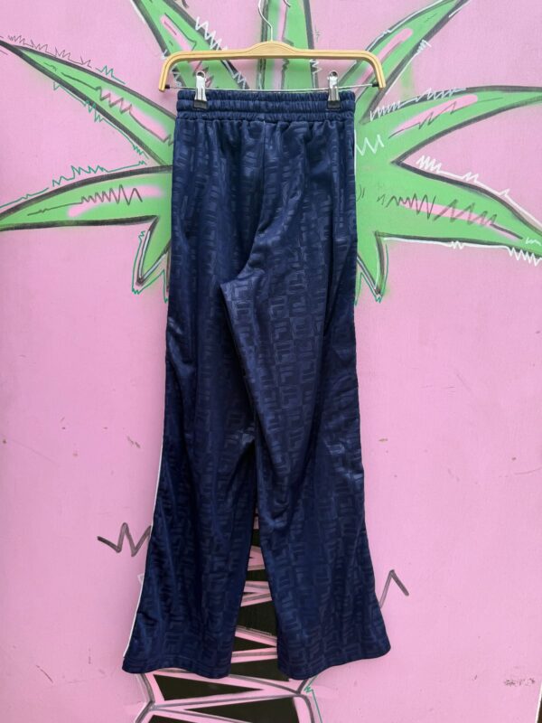 SUBTLE MONOGRAM PRINT FILA FULL SIDE SNAP TRACK PANTS