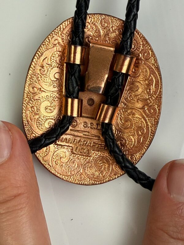 ORNATE EAGLE COPPER BOLO TIE, BLACK BRAIDED LEATHER CORD, DECORATIVE END TIPS