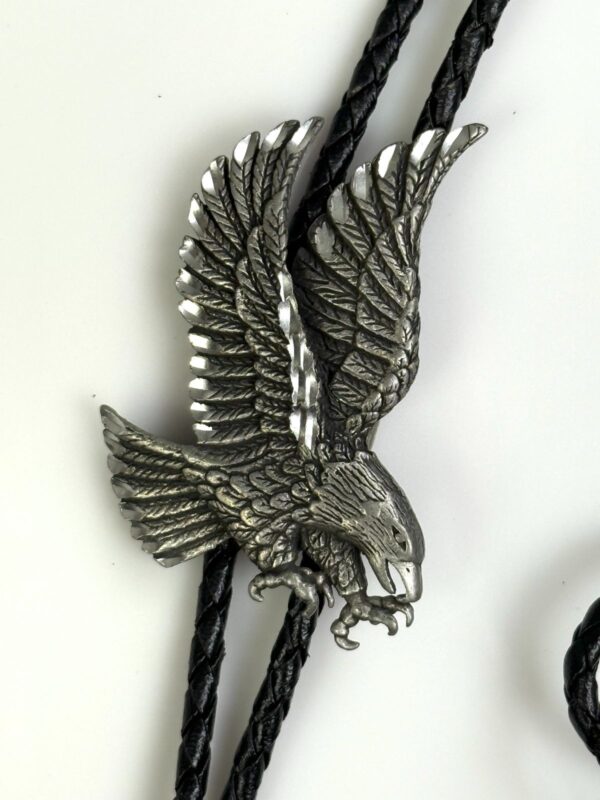 ETCHED PEWTER FLYING EAGLE DESIGN BOLO TIE, BRAIDED LEATHER CORD, SIGNED 89