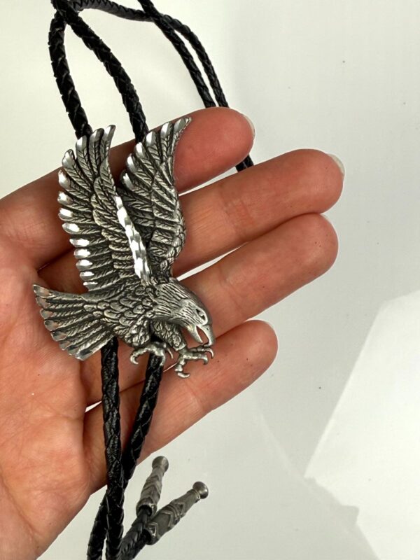 ETCHED PEWTER FLYING EAGLE DESIGN BOLO TIE, BRAIDED LEATHER CORD, SIGNED 89