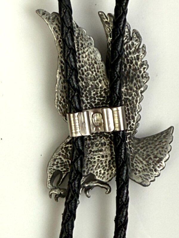 ETCHED PEWTER FLYING EAGLE DESIGN BOLO TIE, BRAIDED LEATHER CORD, SIGNED 89