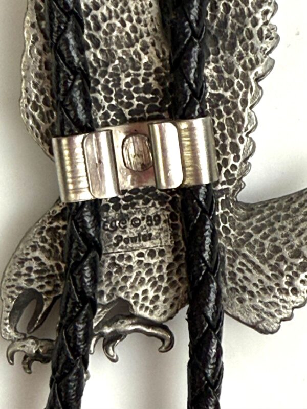 ETCHED PEWTER FLYING EAGLE DESIGN BOLO TIE, BRAIDED LEATHER CORD, SIGNED 89