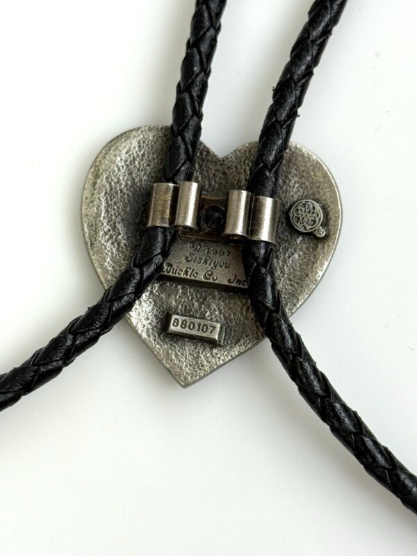 ORNATE HEART PENDANT BOLO TIE, BRAIDED LEATHER CORD