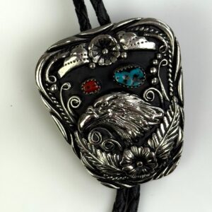 Photo detail:HEAVY ORNATE EAGLE HEAD BOLO TIE, TURQUOISE & CORAL STONES, BRAIDED LEATHER CORD