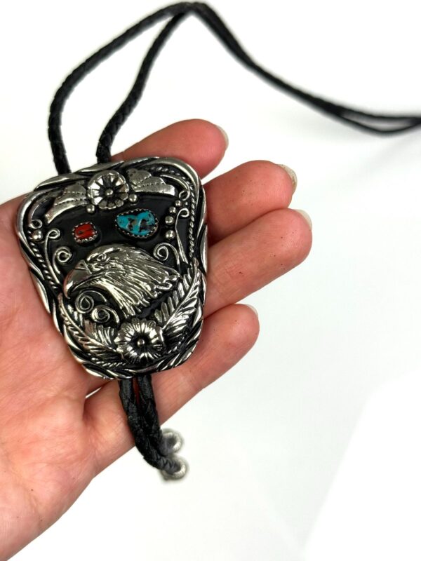 HEAVY ORNATE EAGLE HEAD BOLO TIE, TURQUOISE & CORAL STONES, BRAIDED LEATHER CORD