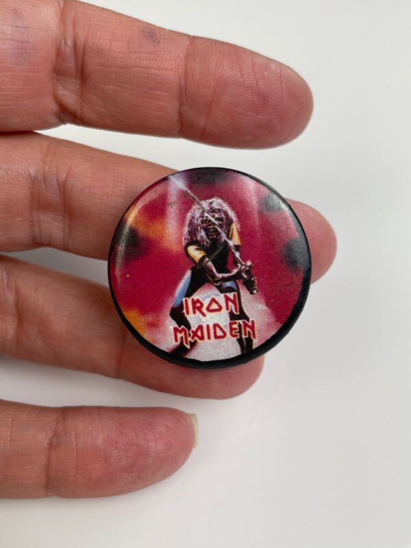 ORIGINAL 1980S IRON MAIDEN EDDIE PLAYING GUITAR GRAPHIC BUTTON PIN