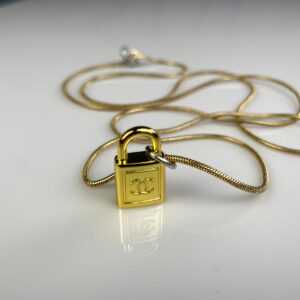 Photo detail:CHANEL PADLOCK CHARM NECKLACE 1980S GOLD PLATED SNAKE CHAIN NECKLACE, SILVER DETAILS