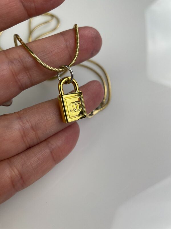 CHANEL PADLOCK CHARM NECKLACE 1980S GOLD PLATED SNAKE CHAIN NECKLACE, SILVER DETAILS