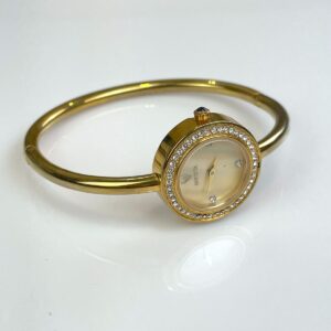 Photo detail:HIGH POLISHED GOLD HINGED BRACELET TIMEPIECE WATCH, CRYSTAL EMBELLISHED MOTHER OF PEARL FACE