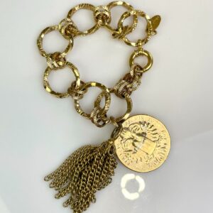 Photo detail:1980S GOLD PLATED TWISTED CHAIN LINK BRACELET, HANGING COIN & TASSEL CHARMS