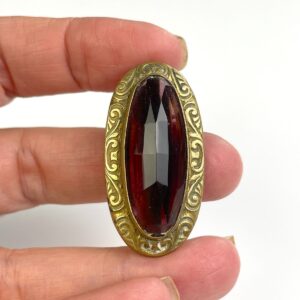 Photo detail:ORNATELY STAMPED ANTIQUE BRASS BROOCH, FACETED AMETHYST STONE