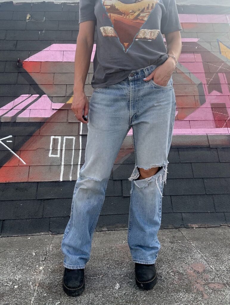 LIGHT WASH & DISTRESSED ORANGE TAB ZIP FLY DENIM JEANS