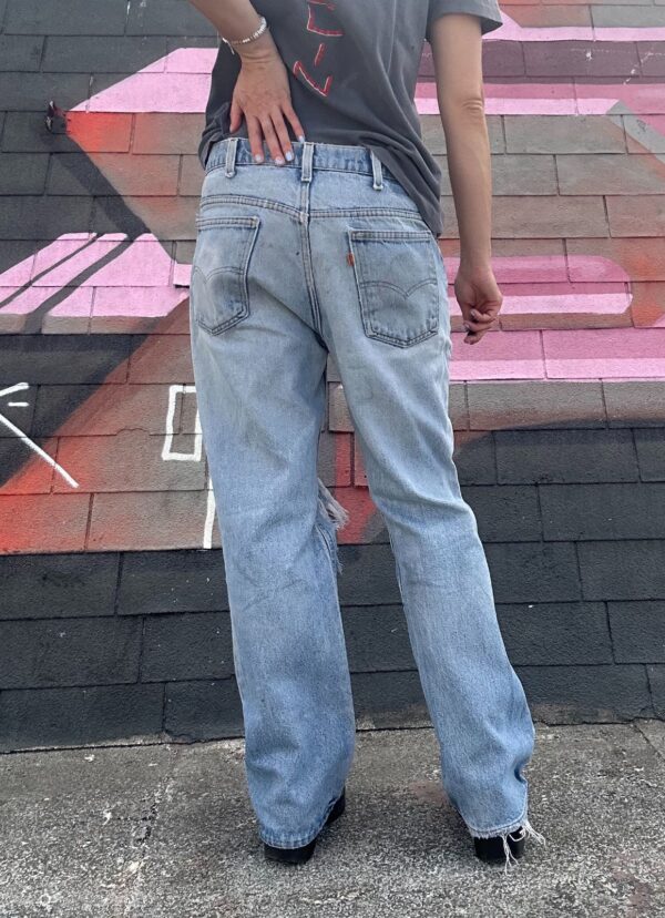 LIGHT WASH & DISTRESSED ORANGE TAB ZIP FLY DENIM JEANS