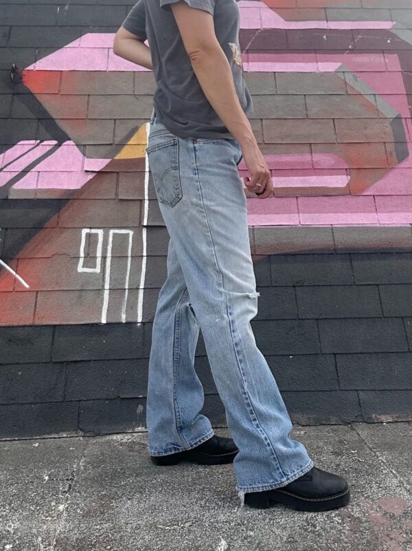 LIGHT WASH & DISTRESSED ORANGE TAB ZIP FLY DENIM JEANS