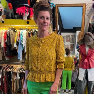 Photo detail:UNIQUE GEOMETRIC LACE OVERLAY LONG SLEEVE PEPLUM STYLE BLOUSE - FAUX PEARL BUTTONS