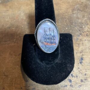 Photo detail:OVAL SHAPED MOTHER OF PEARL INLAY RING W/ SHIP DESIGN