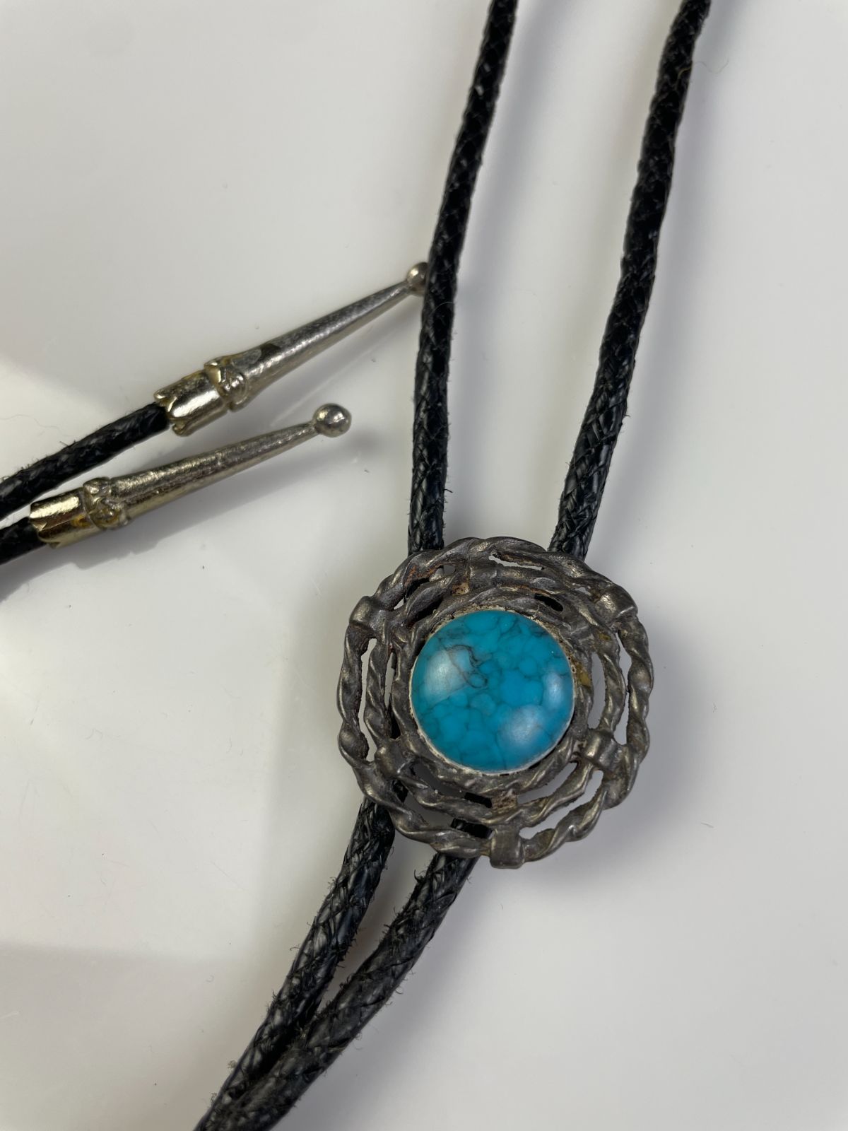 FAUX TURQUOISE ENCASED BOLO TIE, BRAIDED LEATHER CORD in BLACK, BLUE