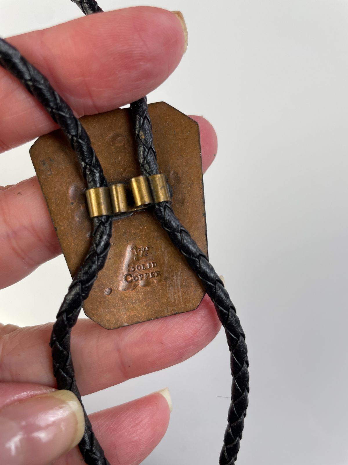 STAMPED COPPER THUNDERBIRD BOLO TIE in BLACK, BROWN