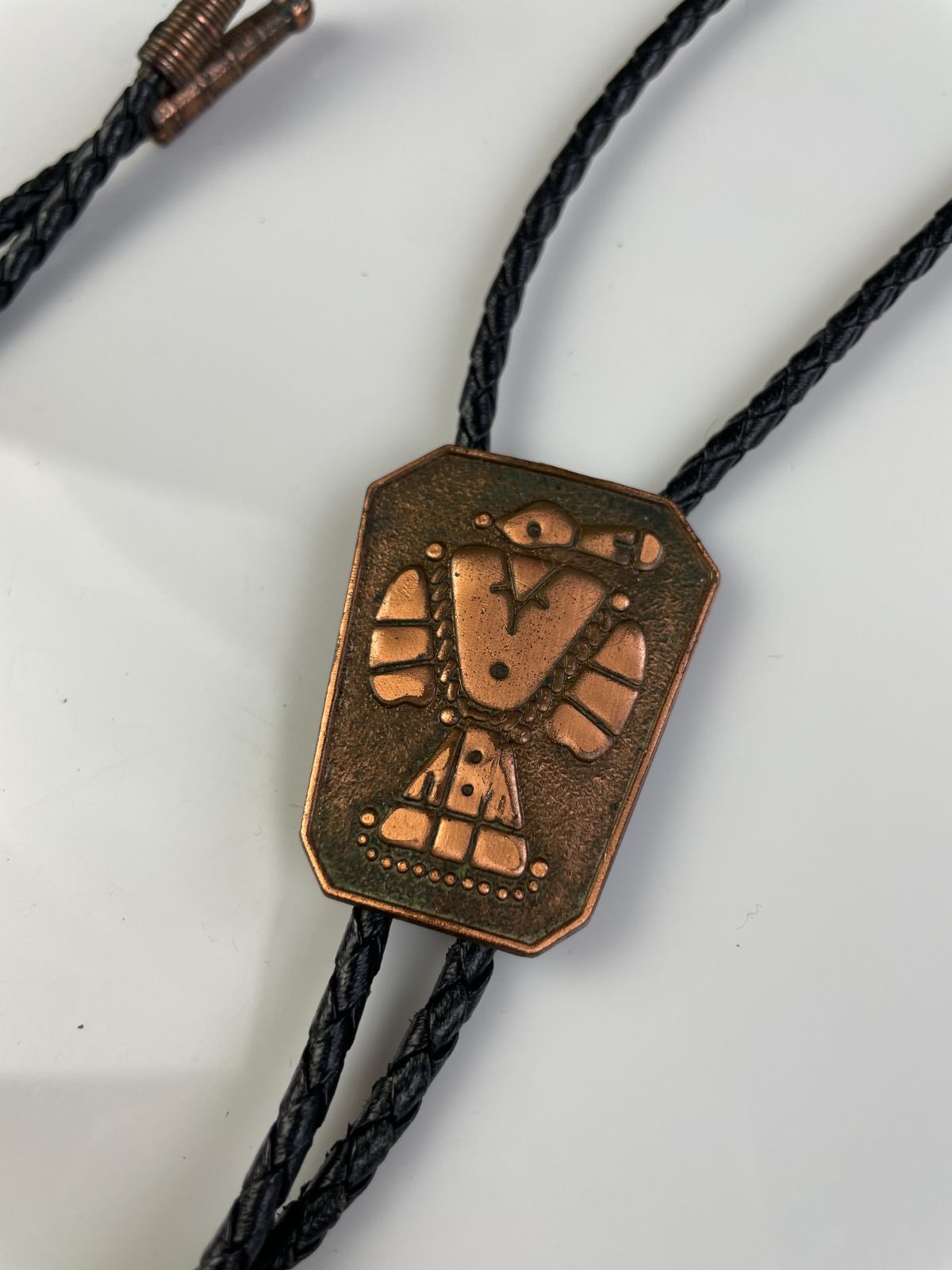 STAMPED COPPER THUNDERBIRD BOLO TIE in BLACK, BROWN
